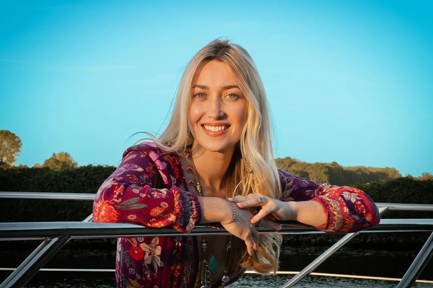 Amy Morris, Miss Norfolk 2026, leaning on the rail of a boat on the water