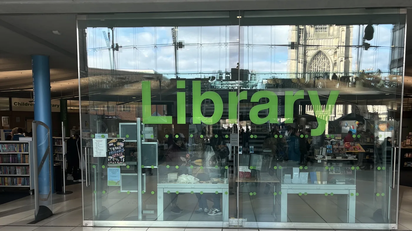 The glass doors into the Millennium Library from The Forum's atrium. The picture does not show the damage.